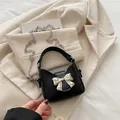 Schwarze Mini-Umhängetasche für Mädchen mit silberner Schleife und Metallkette - Schwarz