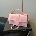 Fashionable pink leather crossbody square bag with wide handle and silver lettering - No Pendant / Pink