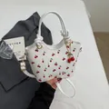 Retro white bucket bag with red cherry print, golden hardware and shoulder strap - Off White