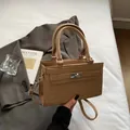 Classic khaki crocodile pattern handbag with silver metal turn-lock and shoulder strap - Khaki