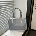 Gray mesh makeup bag with silver metallic handles and rectangular zipper top design - Silver