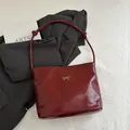 Glossy burgundy tote bag with silver bow accent and adjustable shoulder strap - No Pendant / Red