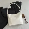 Creamy white hobo bag featuring a metal bow and a cute brown plush bear pendant - With Pendant / White