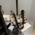 Floral jacquard tote bag with white base and colorful flowers featuring adjustable strap - Black