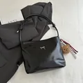 Glossy black tote bag with silver bow accent and plush bear charm for stylish women - With Pendant / Black