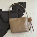 Khaki leather shoulder tote bag with silver bow accent and cute bear pendant charm - With Pendant / Khaki