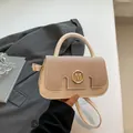 Beige faux leather handbag with woven texture flap and golden M-logo clasp - Khaki