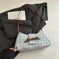 Blue and pink plaid baguette shoulder bag featuring a brown leather bow and strap - Blue