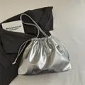 Metallic silver drawstring bucket bag with mirror finish PU leather and soft pleats - Silver