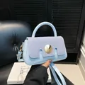 Light blue chic small square handbag with denim flap and golden metal clasp detail - Blue