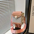 Pink and white monogram crossbody bag with gold heart charm and wide shoulder strap - Pink