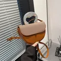 Brown saddle bag with woven texture flap and unique silver artistic metal handle - Brown