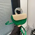 Green leather and beige woven saddle bag with a modern silver liquid metal handle - Green