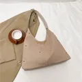 Chic beige hobo bag with gold stud accents and a soft matte finish for urban style - Beige