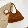 Caramel suede hobo bag with gold rivet accents and spacious interior for women - Brown