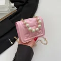 Pink heart quilted mini bag with oversized pearl handle and gold chain strap - Pink