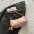 Chic light pink PU leather underarm bag with gold metal clasp and slim shoulder strap - Pink