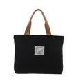 Portable black canvas handbag with brown handles and a minimalist bear label - Black