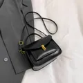 Classic black vintage messenger bag with gold twist lock and smooth PU leather finish - Black