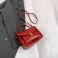 Vintage red leather satchel bag with gold buckle and adjustable strap for women - Red