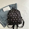 Mini black backpack with pink floral pattern and adjustable fabric straps for women - Black