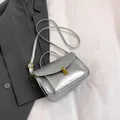 Minimalist silver messenger bag with gold clasp and top handle for women - Silver