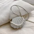 Bolso bandolera plateado con forma de concha, brillo y asa de perlas elegante - Plateado