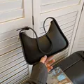 Classic black leather underarm hobo bag with adjustable strap and gold metal hardware - Black
