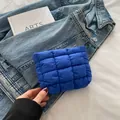Quilted puffer makeup bag in Klein blue with stylish metal zipper closure - Blue