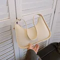 Chic cream white underarm shoulder bag in smooth vegan leather with crescent silhouette - Off White