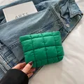 Quilted lime green makeup bag in puffy nylon material with zip closure for daily storage - Green