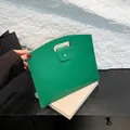 Green lychee pattern envelope handbag with oval cutout handle and metal snap closure - Green