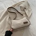 Sac à épaule chic en tissu beige avec bordure en cuir marron et détails dorés - Kaki