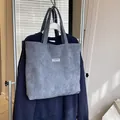 Borsa tote in velluto a coste grigio scuro con etichetta Fashion Instinct e spalline - Grigio