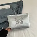 Elegant light blue satin clutch bag with detailed butterfly embroidery for parties - Silver