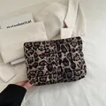 Quilted leopard print clutch bag with soft padded texture and trendy animal pattern - Brown