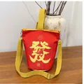 Red canvas drawstring bucket bag with yellow Chinese character and adjustable strap - Red
