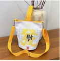 White canvas bucket bag with yellow straps and lucky calligraphy print for casual travel - White