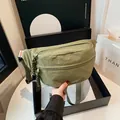 Olive green nylon crossbody chest bag with adjustable wide strap and fashion label - Green