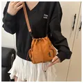 Brown nylon drawstring bucket bag with side mesh pocket and adjustable shoulder strap - Brown