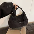 Black pleated nylon crescent bag with adjustable drawstring and wide shoulder strap - Black