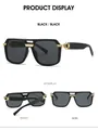 Detail view of square frame sunglasses showing gold metal hinges and black lenses - Black Frame Black Grey Lens