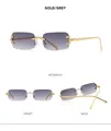 Detail view showing multi-angle gold frames and grey gradient lenses of rimless sunglasses - Gold Frame Gradient Grey Lens