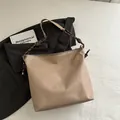 Minimalist beige PU leather tote bag with stylish braided rope strap for winter - Khaki