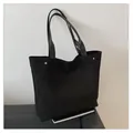 Large black matte suede tote bag with metallic studs and glossy shoulder straps - Black