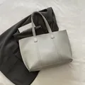 Minimalist light gray faux leather tote bag with stitch detail for office use - Gray