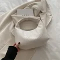 Elegant white woven leather hobo bag with minimalist design for women in casual style - White