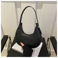 Classic black woven crescent bag with textured leather and silver zipper detail - Braided Style / Black