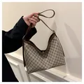 Retro hobo shoulder bag featuring brown monogram canvas and smooth leather trim - Khaki