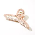 Macro shot of large pink acetate hair claw clip with sparkling rhinestones details - Pink